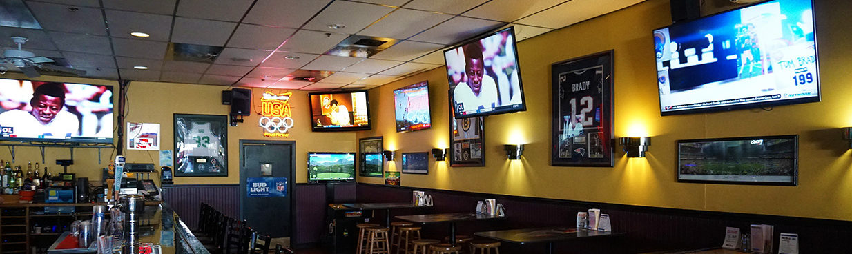 Sports bar interior with multiple screens