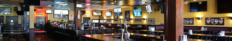 Interior view of Skybox Restaurant showing dining area and sports viewing setup