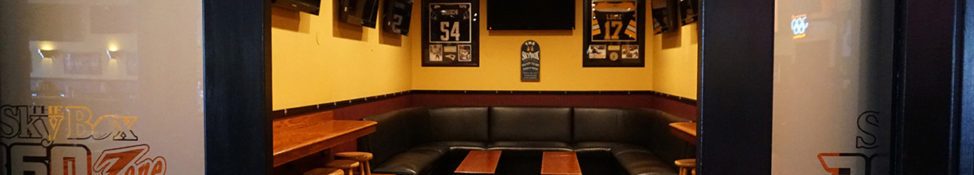Skybox 360 private room with multiple screens and seating for private events